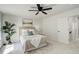Bright bedroom with neutral tones, comfortable bedding, and a peaceful ambiance at 21486 E Crestline Ln, Centennial, CO 80015