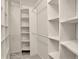 Spacious walk-in closet featuring custom shelving and ample storage at 21486 E Crestline Ln, Centennial, CO 80015
