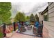 Comfortable deck featuring outdoor seating and views of the fenced backyard at 21486 E Crestline Ln, Centennial, CO 80015