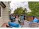 Deck with outdoor seating, rug, and views of the green backyard and fence at 21486 E Crestline Ln, Centennial, CO 80015