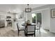 Eat-in kitchen features modern lighting, stainless steel appliances, and access to outdoor space at 21486 E Crestline Ln, Centennial, CO 80015