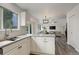Open kitchen overlooks dining area and Gathering room at 21486 E Crestline Ln, Centennial, CO 80015