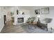Inviting living area with a fireplace, neutral decor, and modern furniture at 21486 E Crestline Ln, Centennial, CO 80015