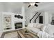 Comfortable living room with a fireplace and staircase that accents the space with natural light at 21486 E Crestline Ln, Centennial, CO 80015
