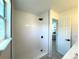 Contemporary bathroom features a pristine white tiled shower and black hardware accents at 21486 E Crestline Ln, Centennial, CO 80015