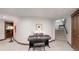 Spacious basement featuring a piano, carpet flooring, and access to the staircase at 718 Locust St, Denver, CO 80220