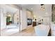 Luxurious bathroom featuring a soaking tub, fireplace, and vanity area, creating a spa-like experience at 718 Locust St, Denver, CO 80220