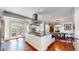 Gourmet kitchen island featuring stainless steel appliances, granite countertops, and ample storage space, a chef's dream at 718 Locust St, Denver, CO 80220