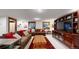 Cozy living room with sectional sofa, wood coffee table, and built-in shelving at 718 Locust St, Denver, CO 80220