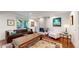Bright living room featuring a fireplace, comfortable seating, hardwood floors, and stylish decor, perfect for relaxing or entertaining at 718 Locust St, Denver, CO 80220