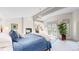 Comfortable main bedroom featuring a fireplace, chandelier, and access to a private balcony, perfect for relaxation at 718 Locust St, Denver, CO 80220