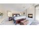 Serene main bedroom with a fireplace, vaulted ceiling, and elegant chandelier, offering a peaceful retreat at 718 Locust St, Denver, CO 80220