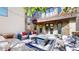 Inviting patio with comfortable seating, a fire pit, and an outdoor dining area at 718 Locust St, Denver, CO 80220