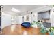 Cozy sitting area with stylish blue sofa, wet bar, and ample natural light, creating a relaxing atmosphere at 718 Locust St, Denver, CO 80220