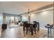 Spacious dining room featuring a table with chairs and a sliding glass door to a patio at 975 N Lincoln St # 4I, Denver, CO 80203