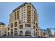 Stunning multi-story building with brick facade, balconies, and unique architectural details at 975 N Lincoln St # 4I, Denver, CO 80203