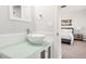 Stylish bathroom featuring a vessel sink on a modern vanity at 17294 W 60Th Ct, Arvada, CO 80403