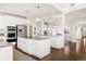 Spacious kitchen featuring a large island, stainless appliances, and granite countertops at 17294 W 60Th Ct, Arvada, CO 80403