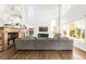 Spacious living room featuring high ceilings, fireplace, and large windows at 17294 W 60Th Ct, Arvada, CO 80403