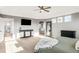 Serene main bedroom with plush carpeting, dresser, and natural light with a glimpse into the bathroom at 17294 W 60Th Ct, Arvada, CO 80403