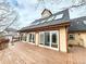 Spacious deck with sliding glass doors and outdoor lighting, great for entertaining at 2418 W Euclid Ave, Littleton, CO 80120