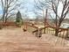 Wooden deck and backyard with mature trees and wooden fence at 2418 W Euclid Ave, Littleton, CO 80120