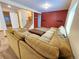 Spacious finished basement with a large sectional couch and stairs leading to another level at 2418 W Euclid Ave, Littleton, CO 80120