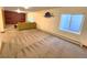 Large finished basement featuring carpet floors, recessed lights, and a mounted marlin decoration at 2418 W Euclid Ave, Littleton, CO 80120