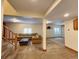 Spacious carpeted basement with a neutral color palette and recessed lighting at 2418 W Euclid Ave, Littleton, CO 80120
