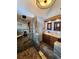 Modern bathroom featuring dual shower heads, granite counters, and rustic wood cabinetry at 2418 W Euclid Ave, Littleton, CO 80120