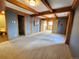 Bedroom with neutral carpet, wooden beams, and ample space for furnishings at 2418 W Euclid Ave, Littleton, CO 80120