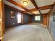 Large bedroom with neutral carpet, wooden beams, and abundant natural light at 2418 W Euclid Ave, Littleton, CO 80120