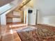 Finished attic bonus room with terracotta tile flooring, wet bar, and ample storage at 2418 W Euclid Ave, Littleton, CO 80120