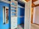 Bedroom closet featuring shelving, drawers, and mirrored door at 2418 W Euclid Ave, Littleton, CO 80120