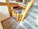 Carpeted stairs with wooden banister, showcasing open floor plan below at 2418 W Euclid Ave, Littleton, CO 80120