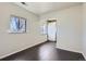Dining room area featuring bright natural light and dark hardwood flooring throughout at 2865 S Fairfax St, Denver, CO 80222