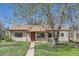 Charming single-story home with a well-maintained lawn and mature tree in a residential neighborhood at 2865 S Fairfax St, Denver, CO 80222