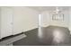 Open living room with wood flooring, a ceiling fan, and abundant natural light at 2865 S Fairfax St, Denver, CO 80222