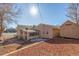 Landscaped backyard with shed, patio and wooden fence at 381 El Paso Ct, Denver, CO 80221