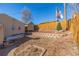 The backyard features a shed, a Colorado flag, and landscaping in the background at 381 El Paso Ct, Denver, CO 80221