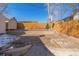 The backyard features a shed, a Colorado flag, and landscaping in the background at 381 El Paso Ct, Denver, CO 80221