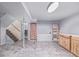 Finished basement area with storage, cabinets, and stairs at 381 El Paso Ct, Denver, CO 80221