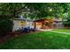 Spacious backyard with a patio dining area and a fire pit, perfect for outdoor relaxation at 3047 N Milwaukee St, Denver, CO 80205