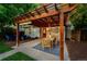 Expansive backyard with an outdoor dining area, fire pit, and lush green lawn, ideal for gatherings at 3047 N Milwaukee St, Denver, CO 80205