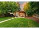 Picturesque backyard featuring a dining area under a pergola and cozy fire pit, great for gatherings at 3047 N Milwaukee St, Denver, CO 80205