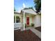 Welcoming front entrance with a charming red door, decorative planters, and visible house number, '3047' at 3047 N Milwaukee St, Denver, CO 80205