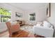 Cozy living room with hardwood floors, stylish seating, and a large window providing natural light and views at 3047 N Milwaukee St, Denver, CO 80205