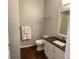 Cozy bathroom featuring a white vanity, modern fixtures and a decorative framed mirror at 9557 W San Juan Cir # 207, Littleton, CO 80128