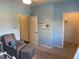 Bedroom with a comfortable chair and access to a closet at 9557 W San Juan Cir # 207, Littleton, CO 80128