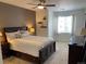 Bedroom with comfortable king bed, ceiling fan and natural light at 9557 W San Juan Cir # 207, Littleton, CO 80128